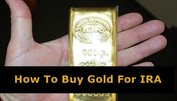 Man holding a gold bar in hand